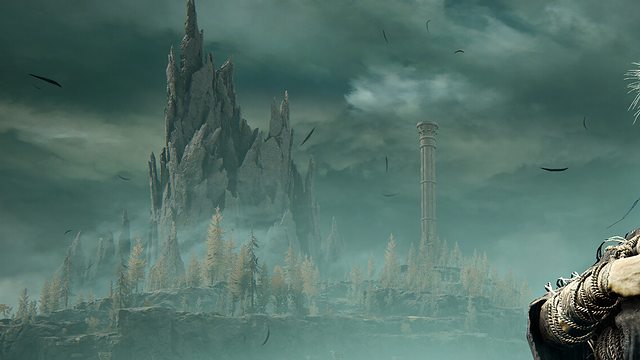 A distant castle over a grey sea, seen from a grassy cliff