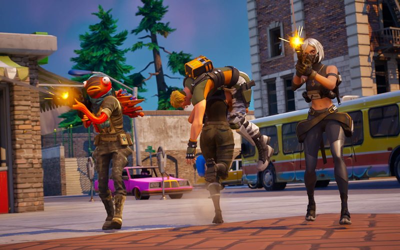 A squad running past a bus down a town street